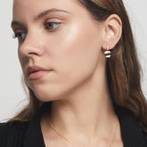Aretes de ondas de monedas